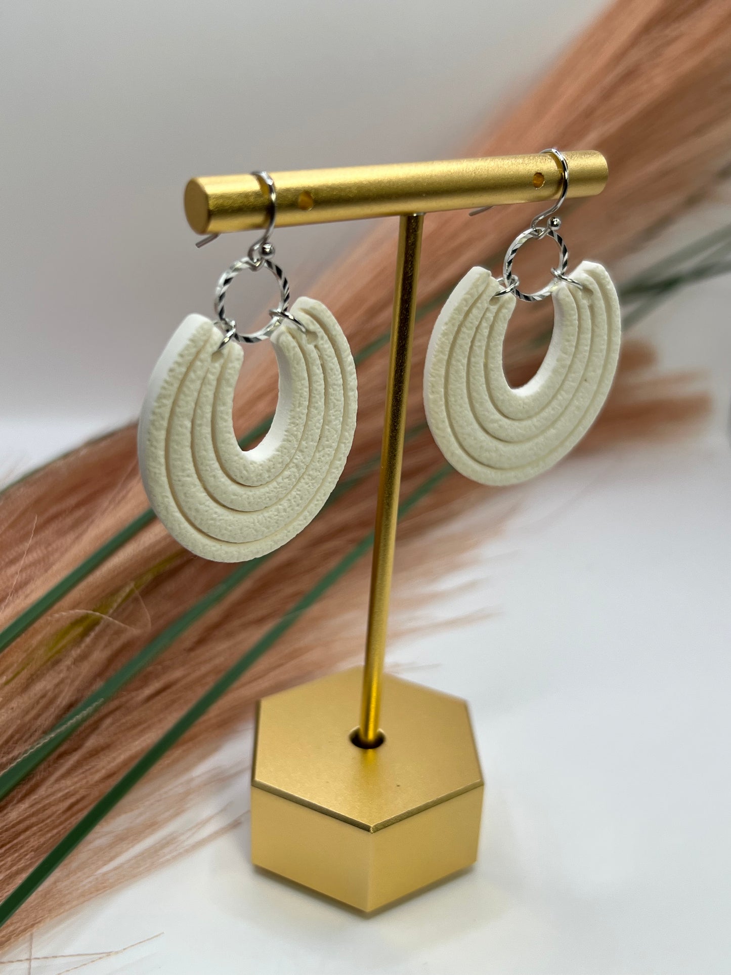 White imprinted dangles