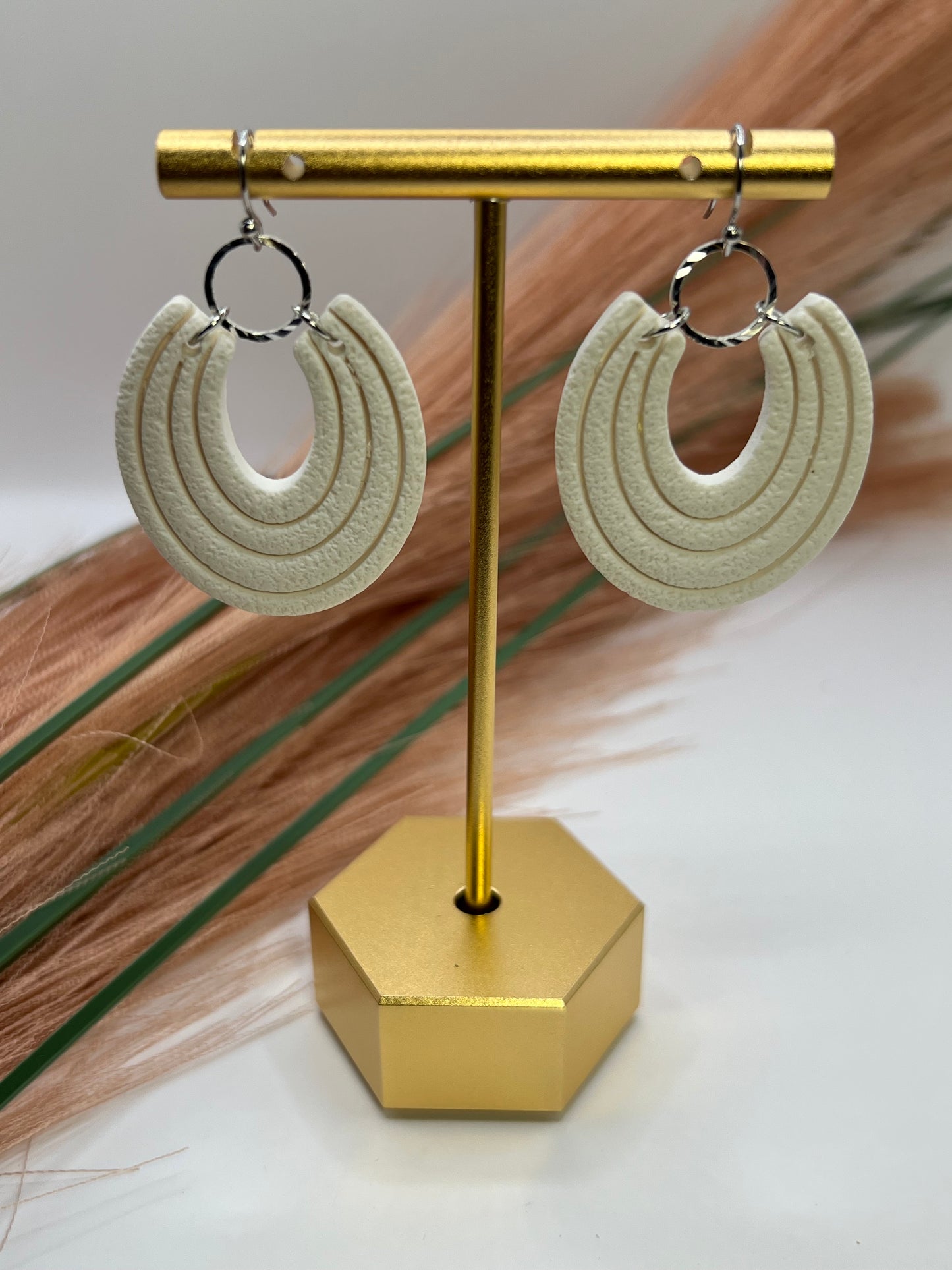 White imprinted dangles