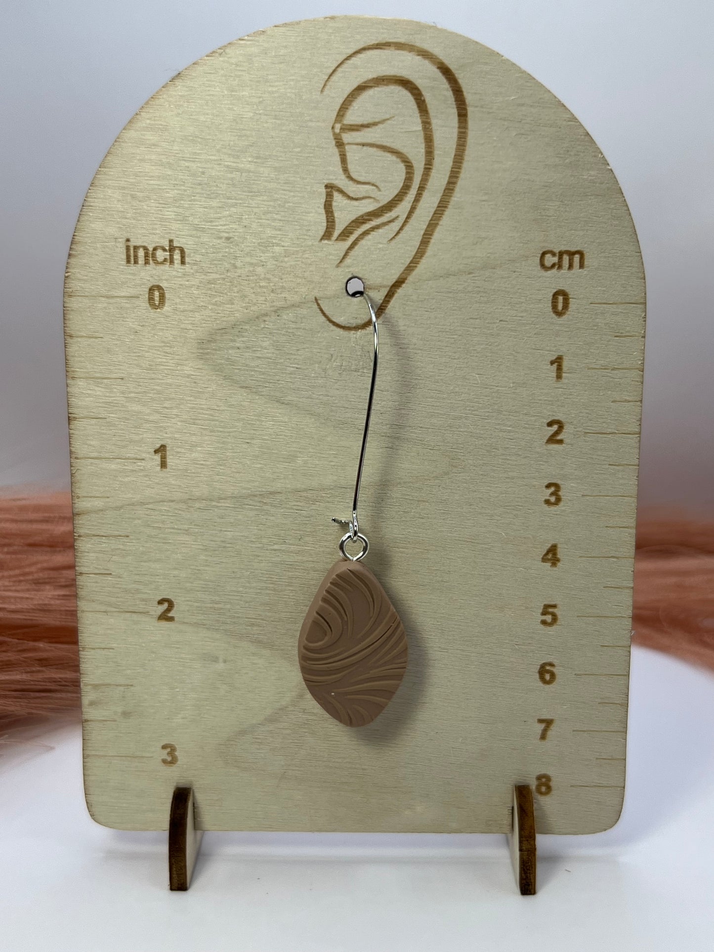 Brown elongated oval dangles