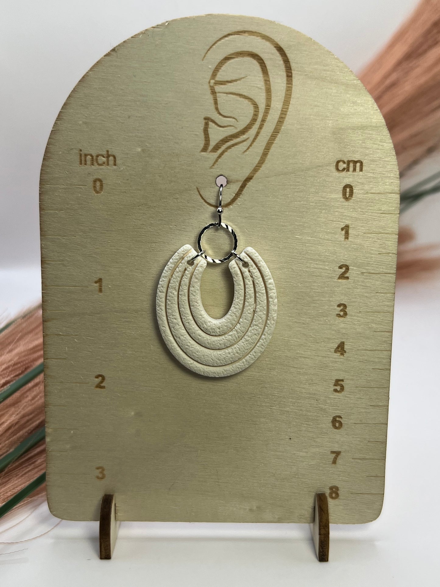 White imprinted dangles