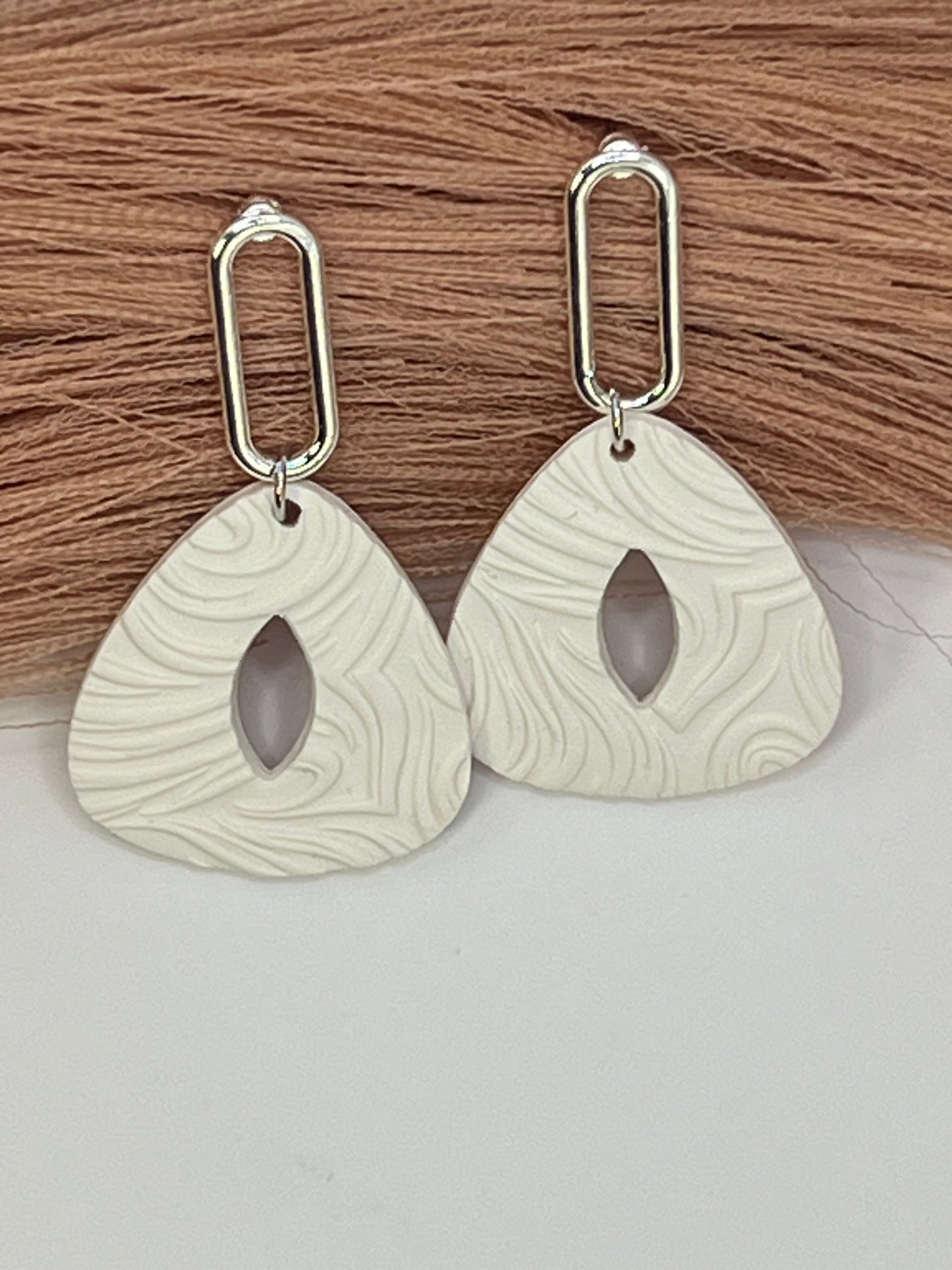 White imprinted swirl dangles