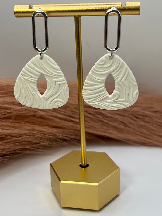 White imprinted swirl dangles