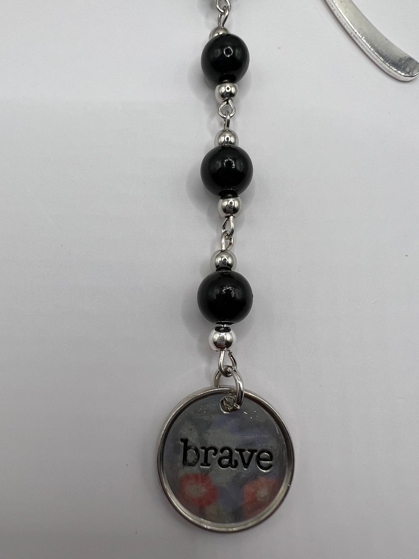 Black “brave” beaded bookmark