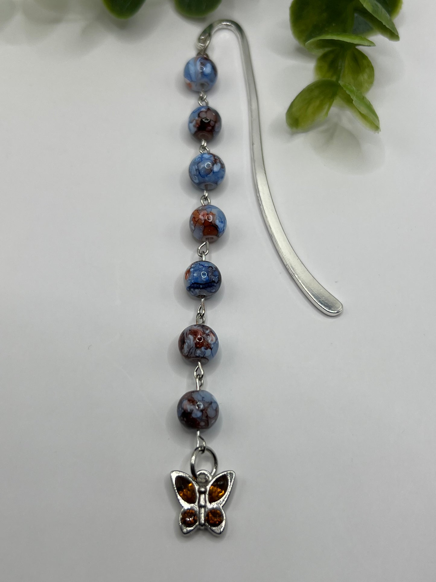 Blue and brown faux marble beaded bookmark with butterfly charm