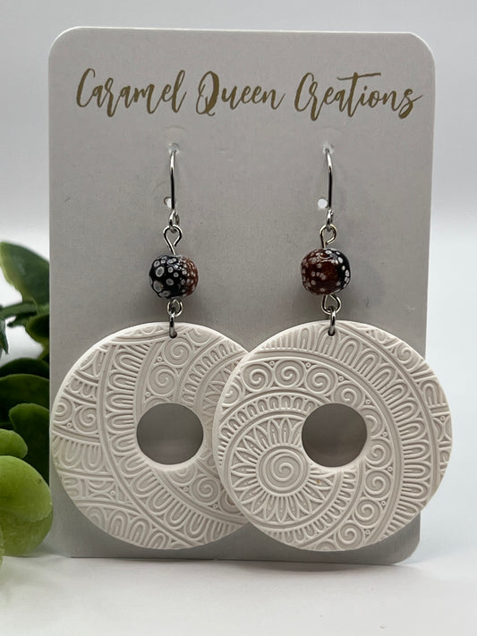White imprinted dangles