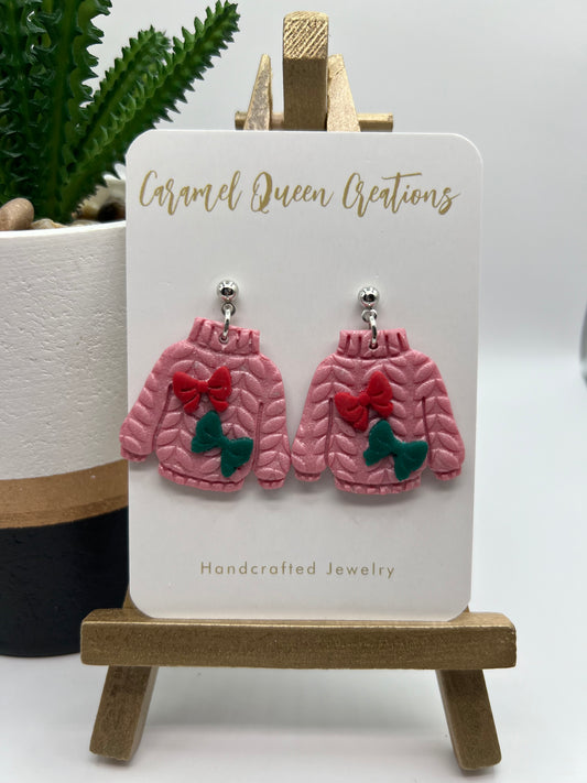 Pearl pink ugly sweater with red and green bows
