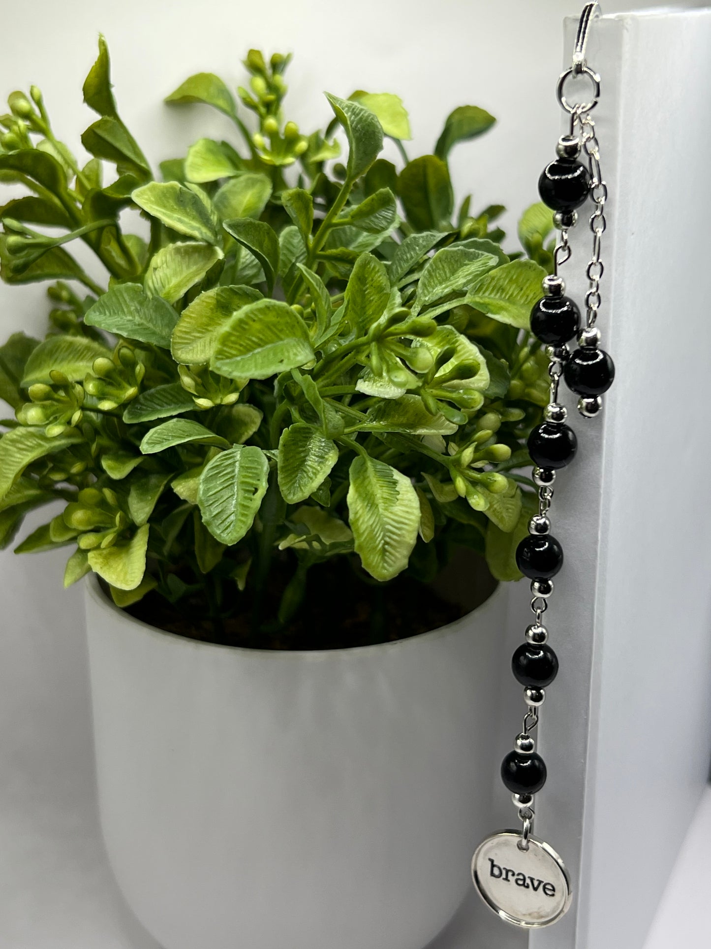 Black “brave” beaded bookmark