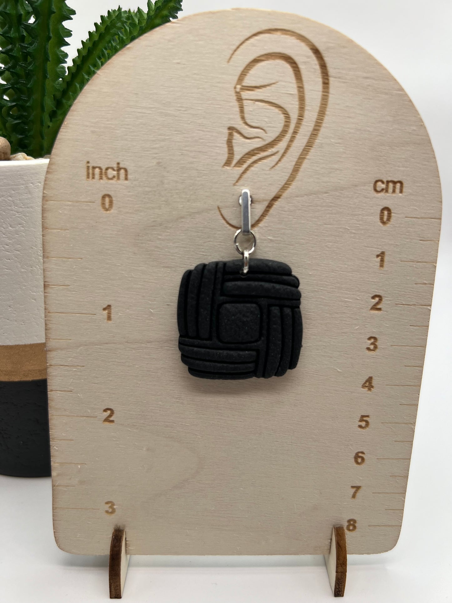 Black imprinted square dangles