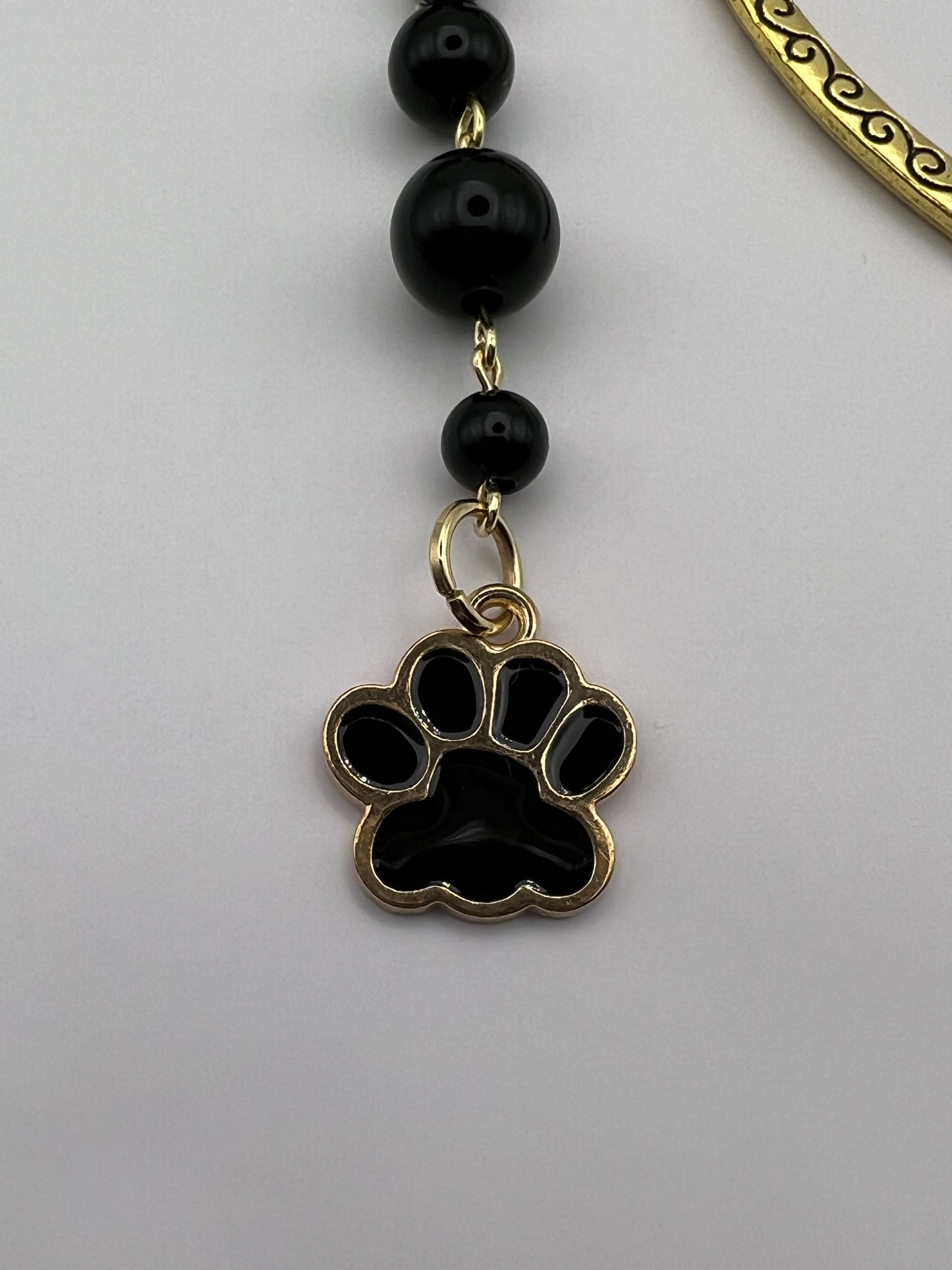 Black and gold dog paw beaded bookmark