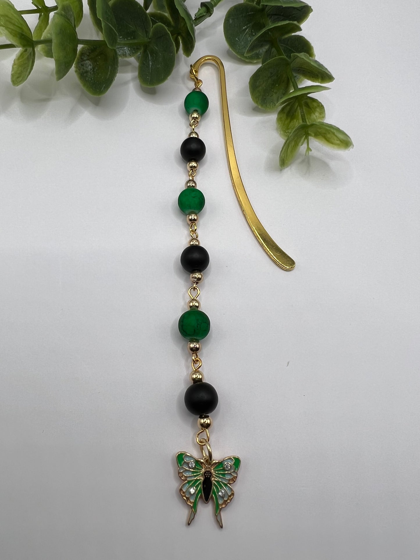 Green and black beaded bookmark with butterfly charm