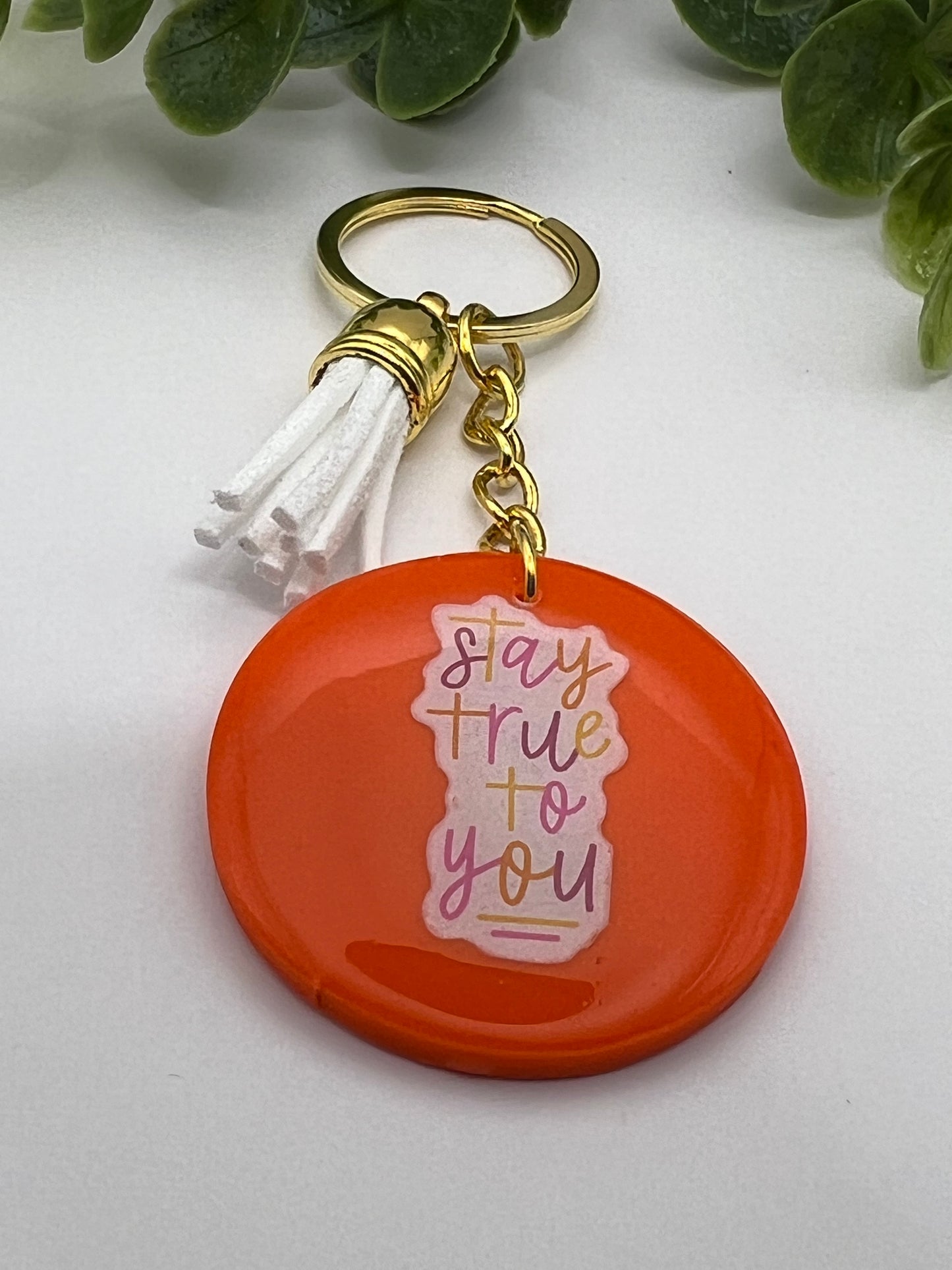 Bright orange ”true” keychain w/ tassel