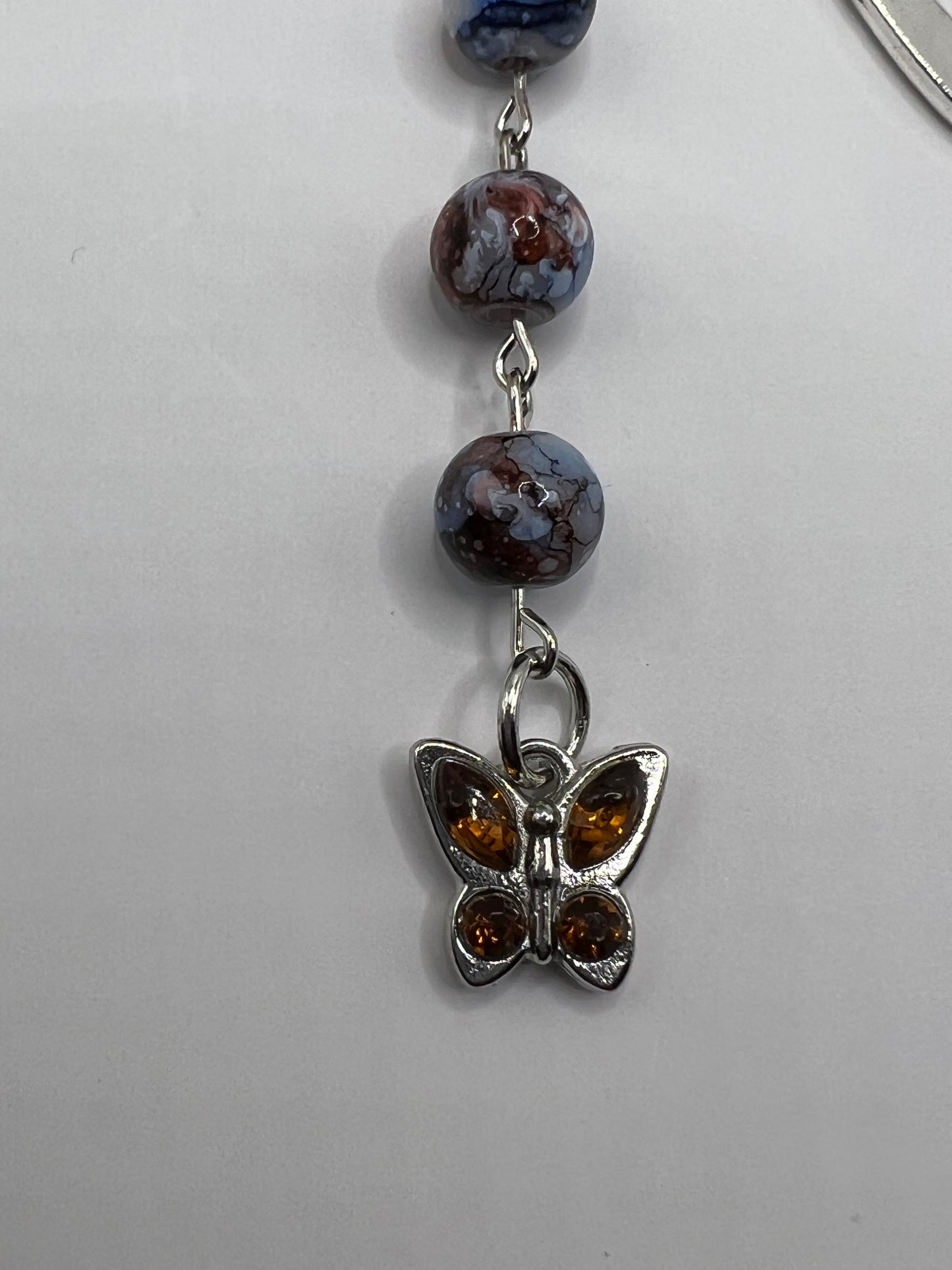 Blue and brown faux marble beaded bookmark with butterfly charm