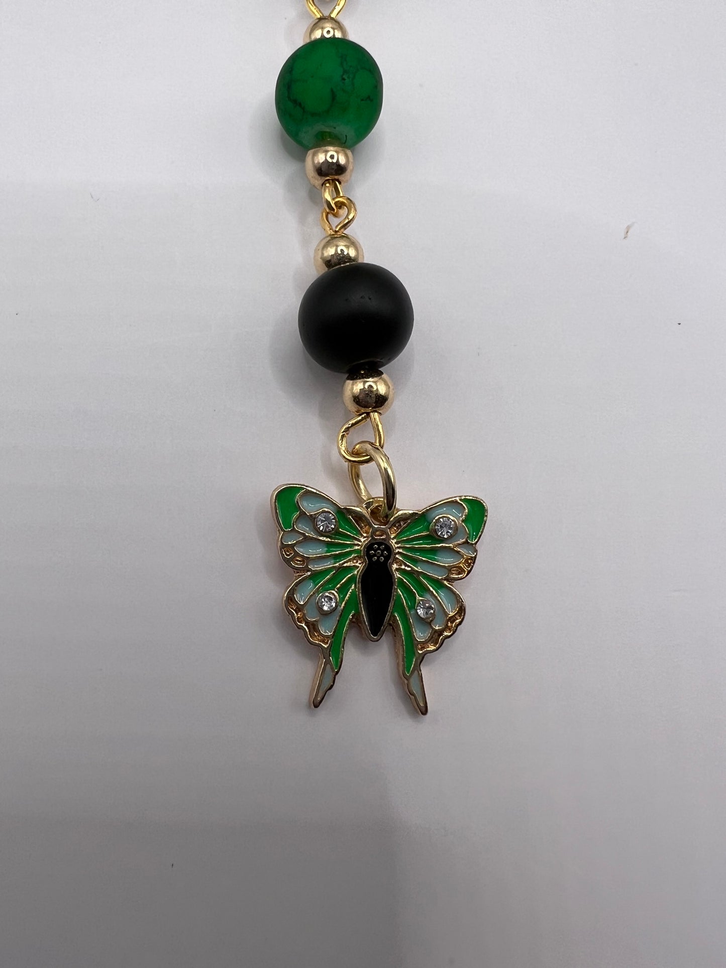 Green and black beaded bookmark with butterfly charm