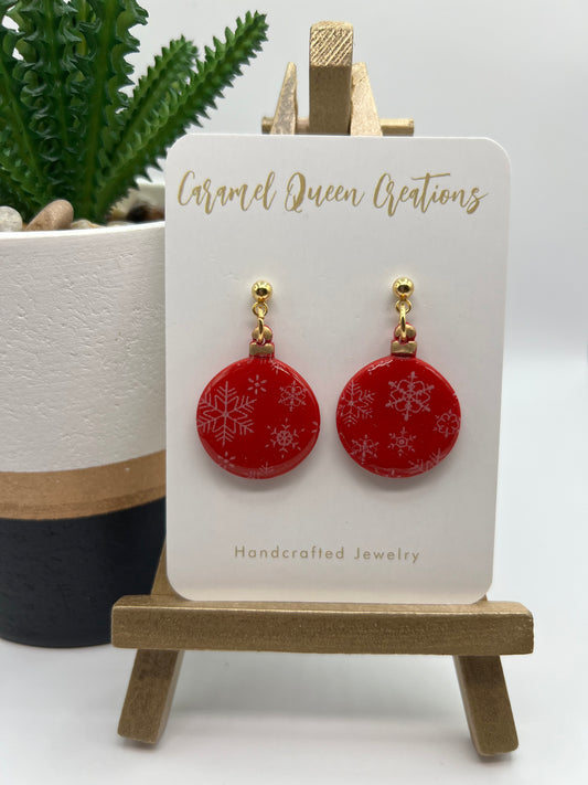 Red ornament with white snowflake print