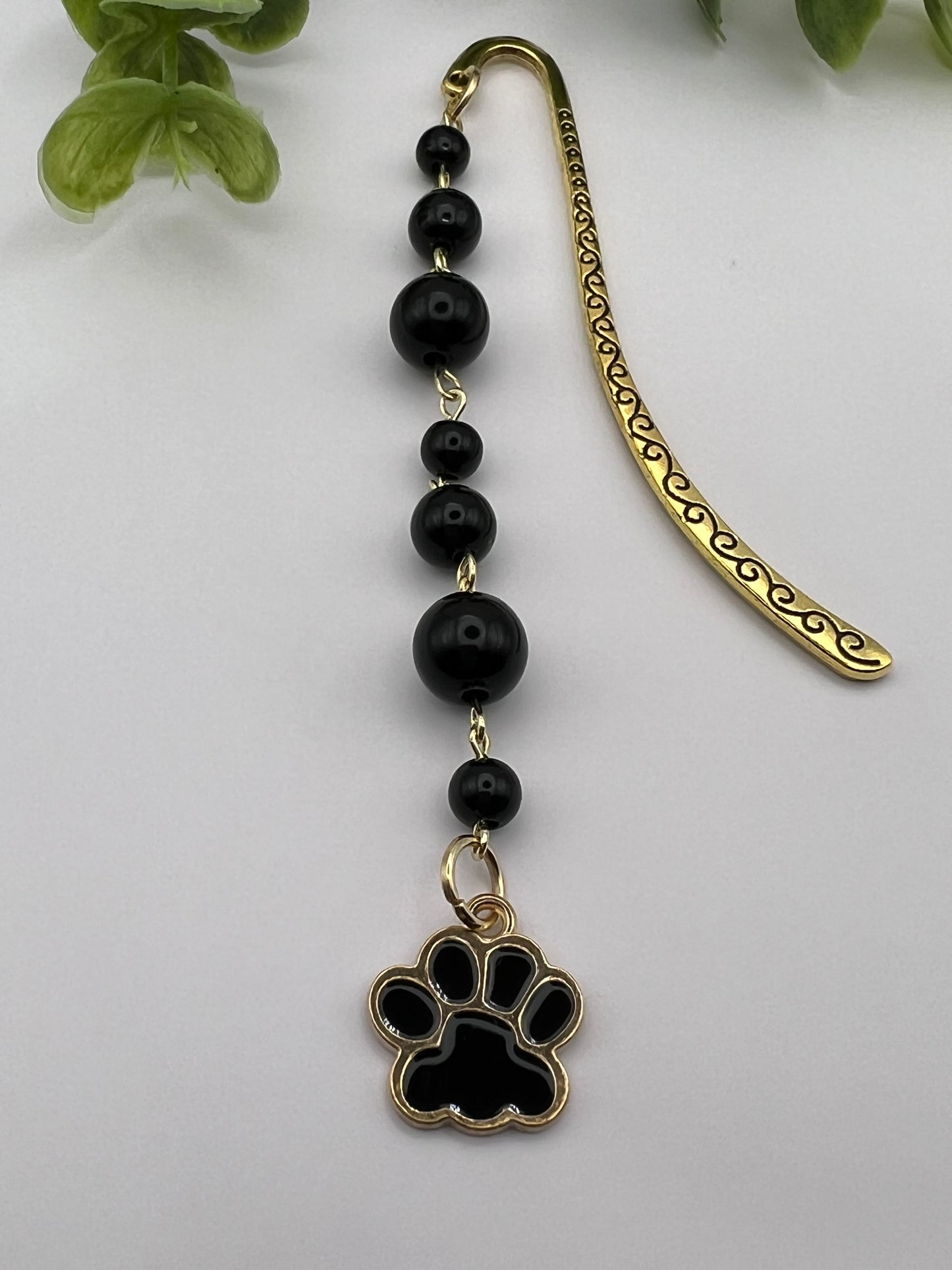 Black and gold dog paw beaded bookmark