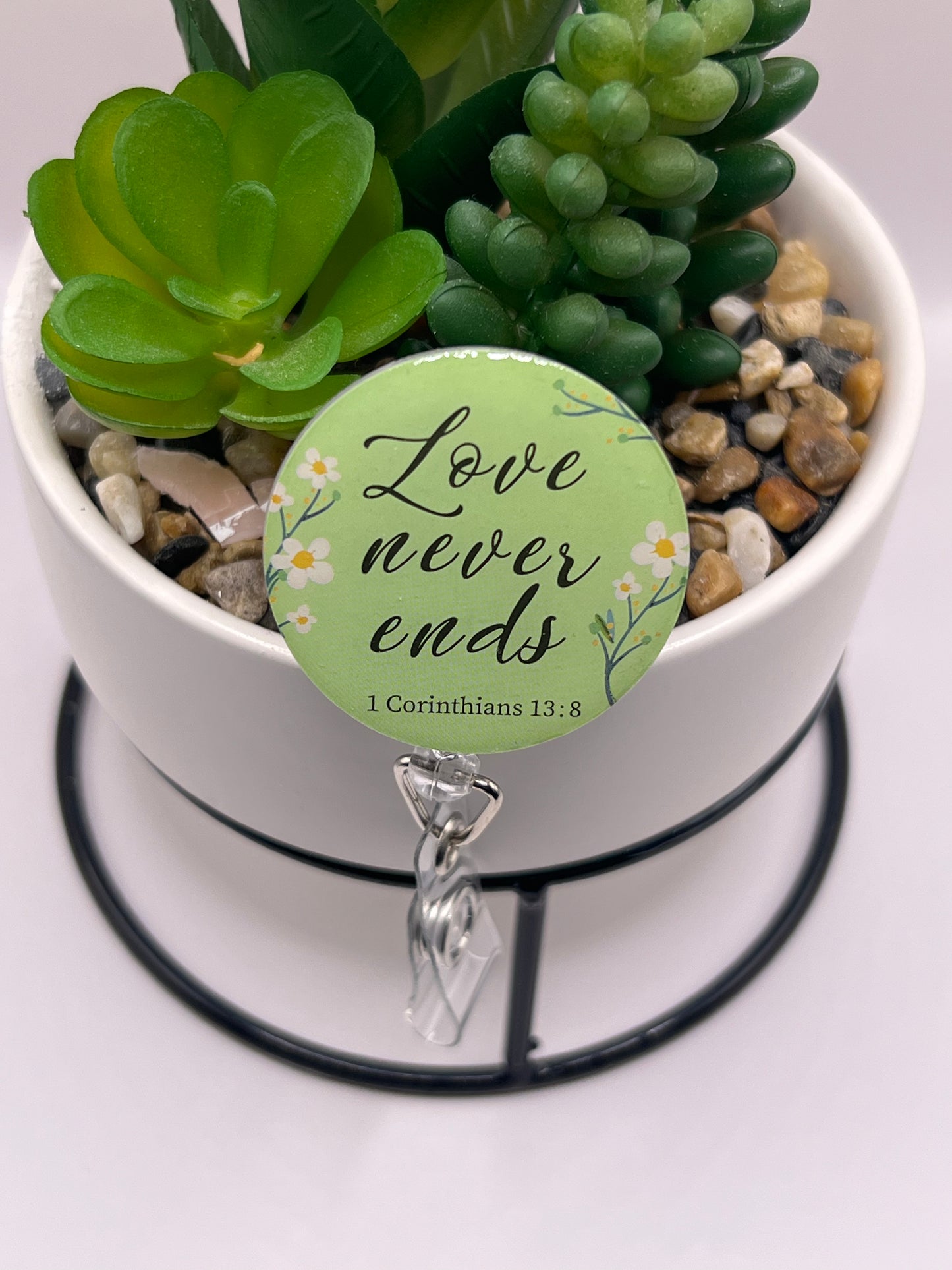 “Love never ends” badge reel